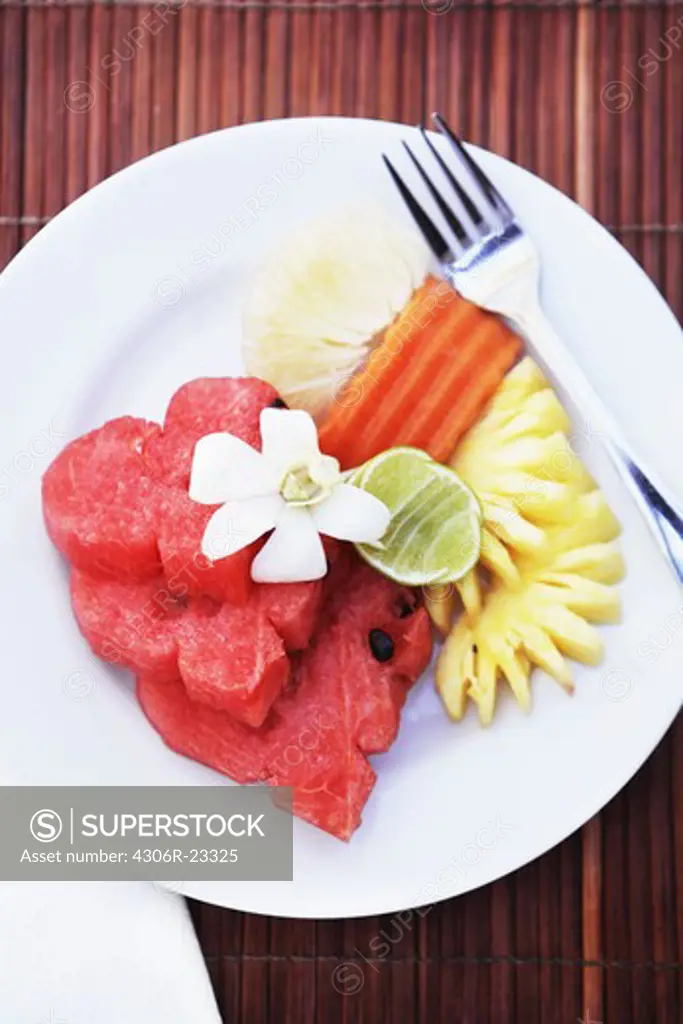 Slices of fruits on plate