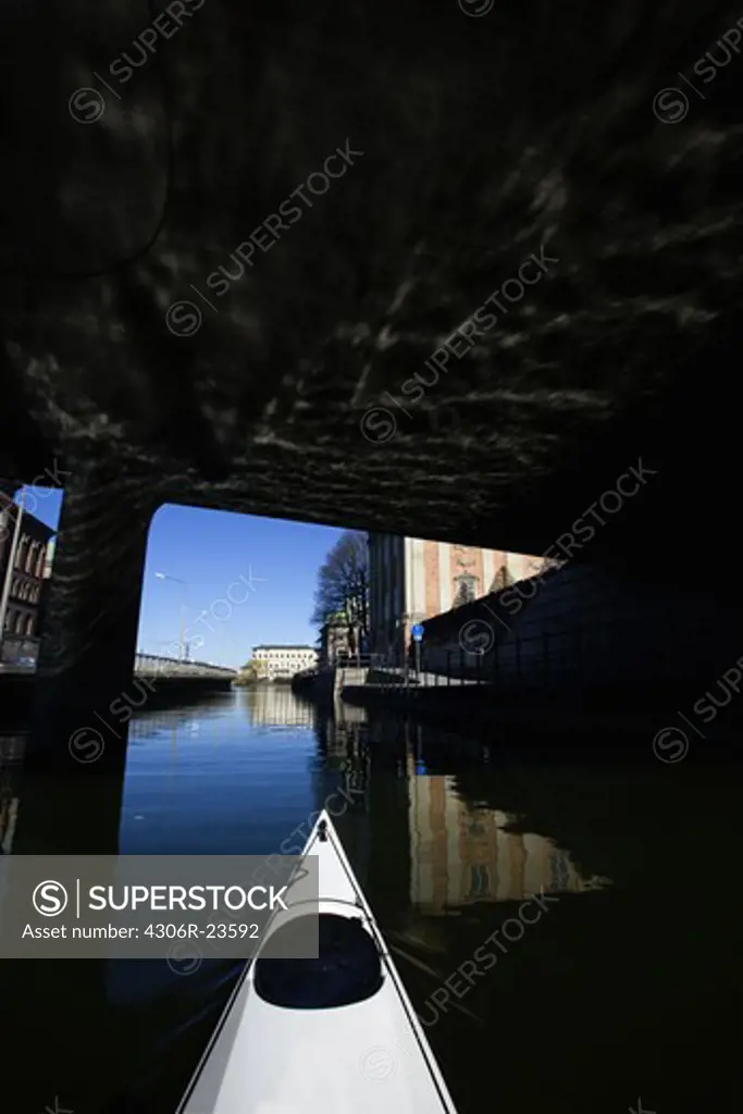 Kayak under a bridge, Sweden.
