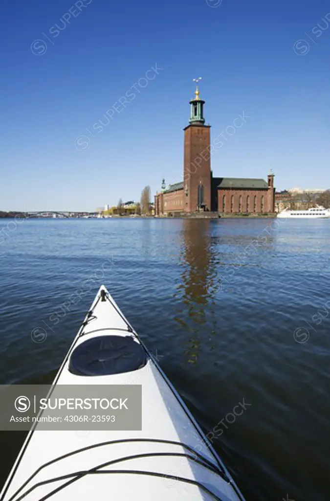 Kayak in front of the City Hall, Stockholm, Sweden.