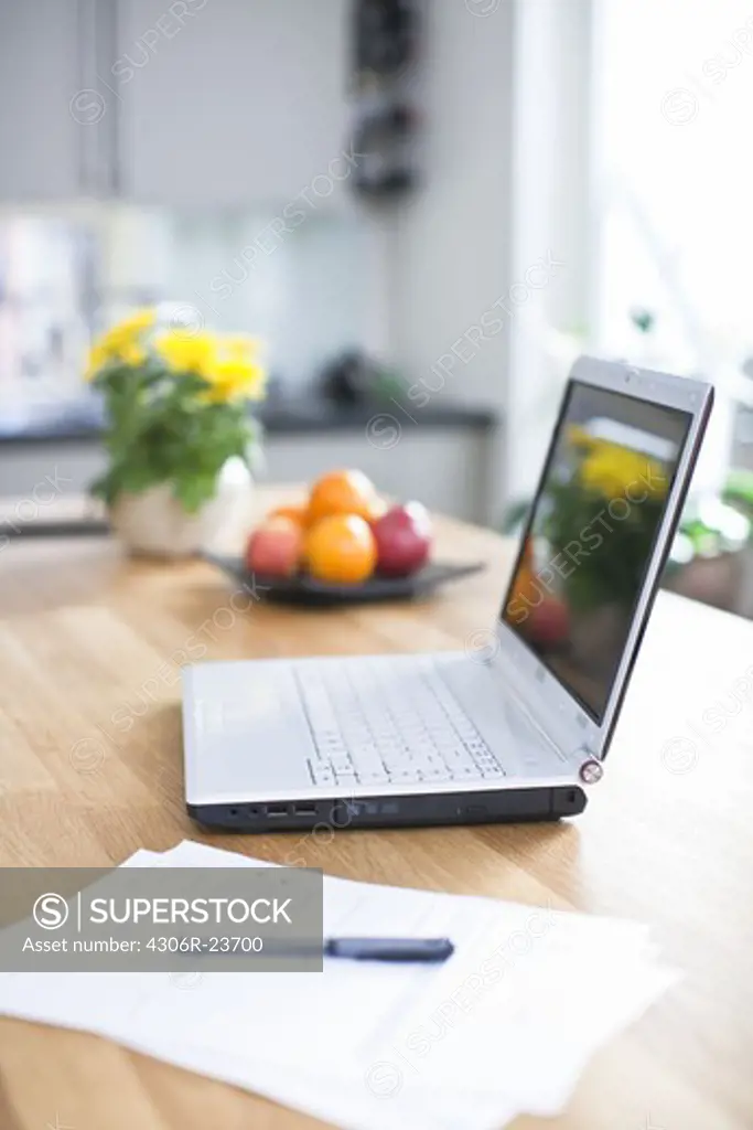 Laptop on kitchen table