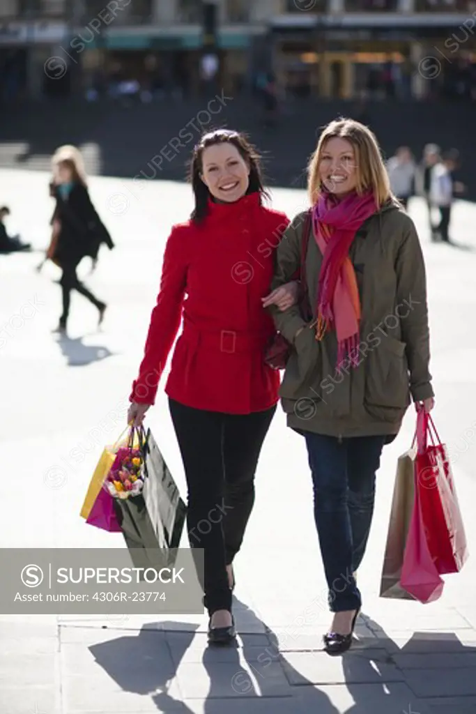 Pair of young women shopping