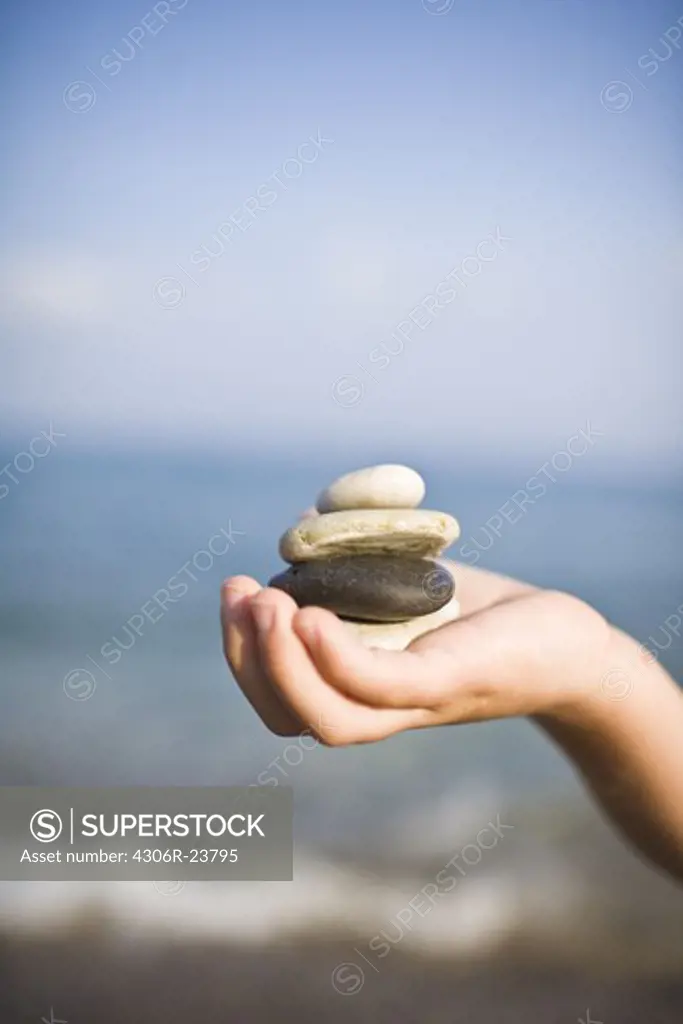 Child holding stones