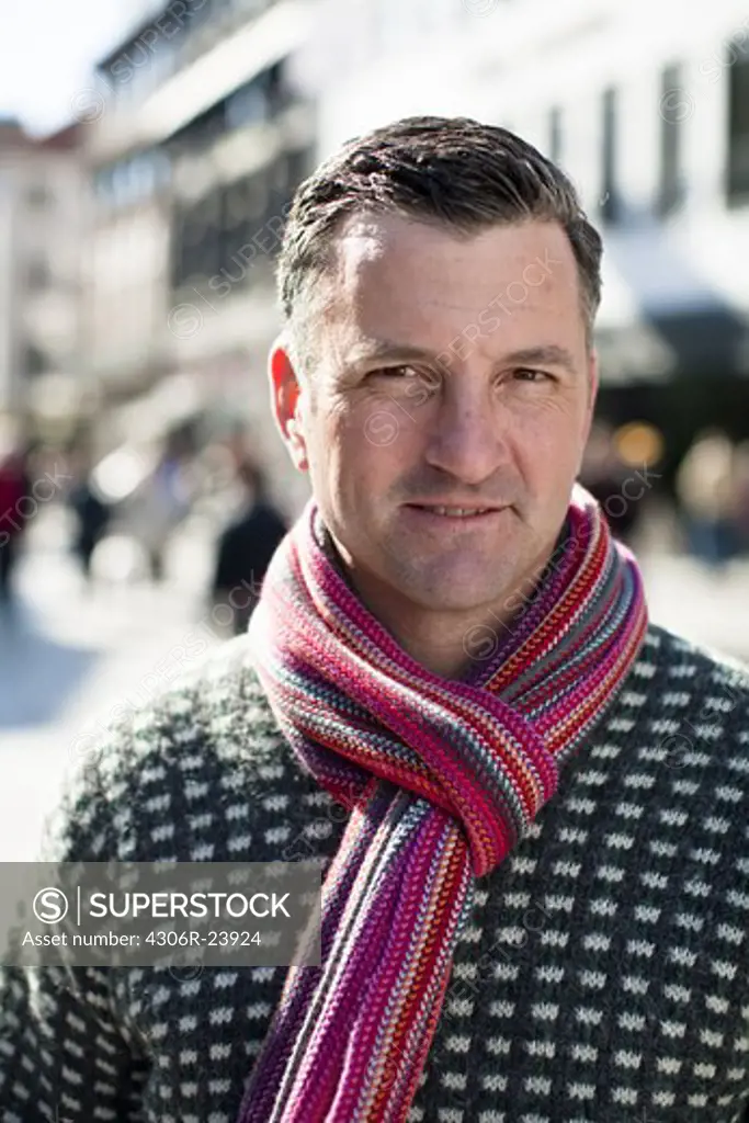 Portrait of mid adult man wearing scarf