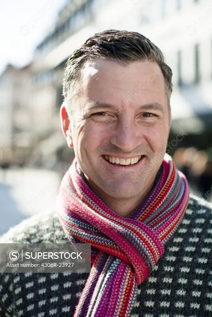 Portrait of mid adult man wearing scarf