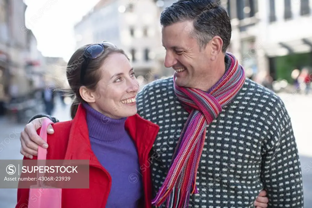 Mid adult couple walking at street