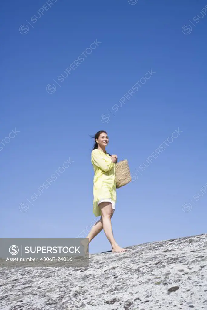 Woman walking on rock