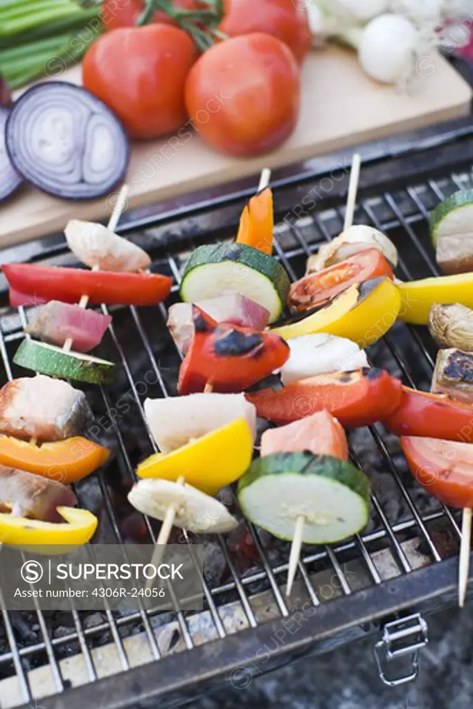 Skewers with vegetables on barbecue grill