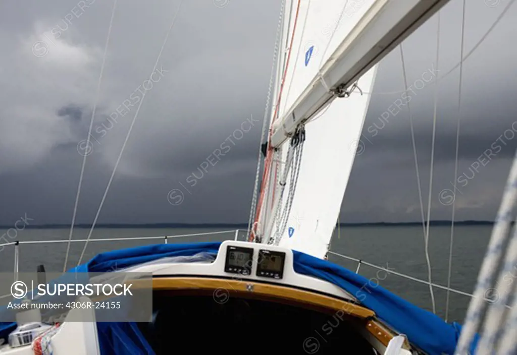 Sailing boat in stormy weather