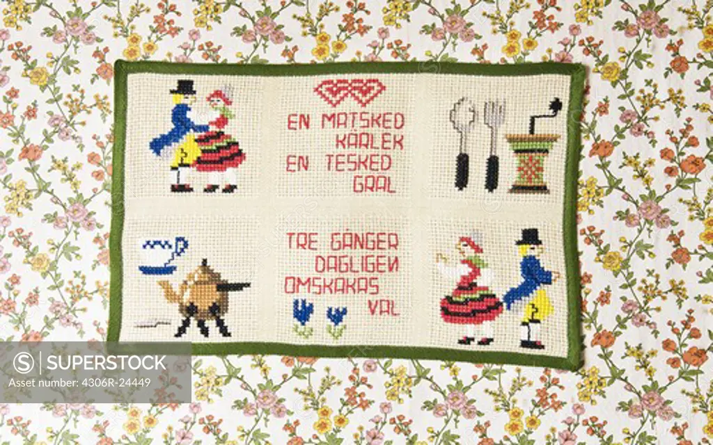 Embroidered message on a wall hanging, Sweden.