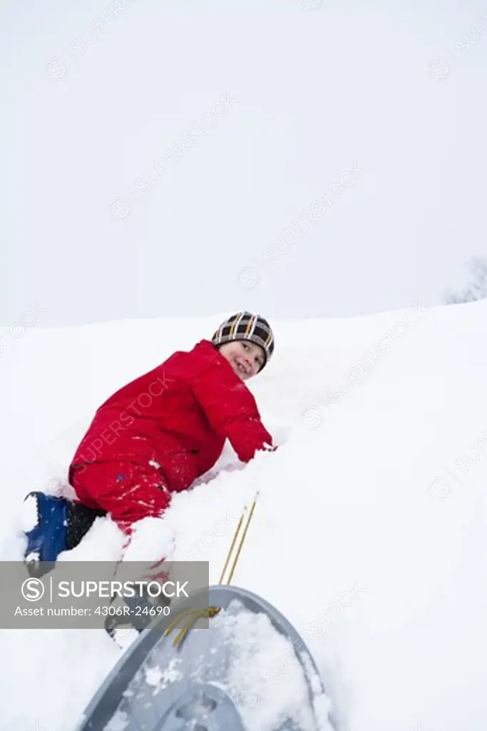 Boy playing on snow