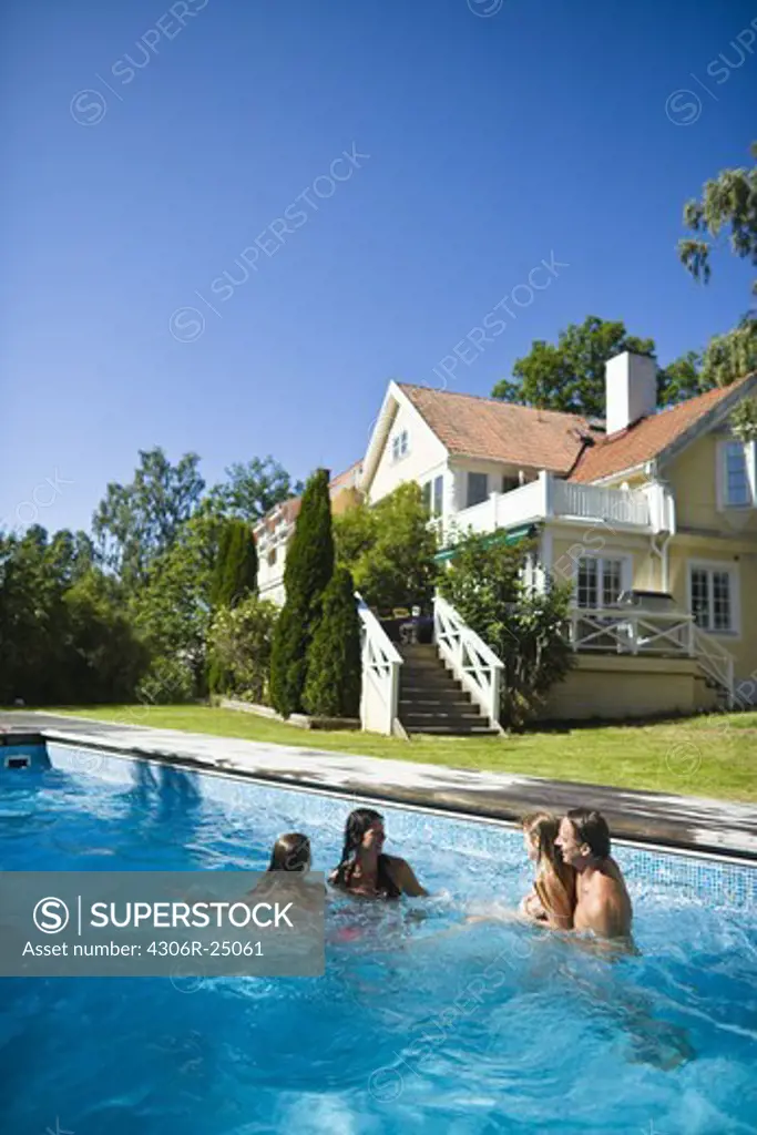 Family in swimming pool