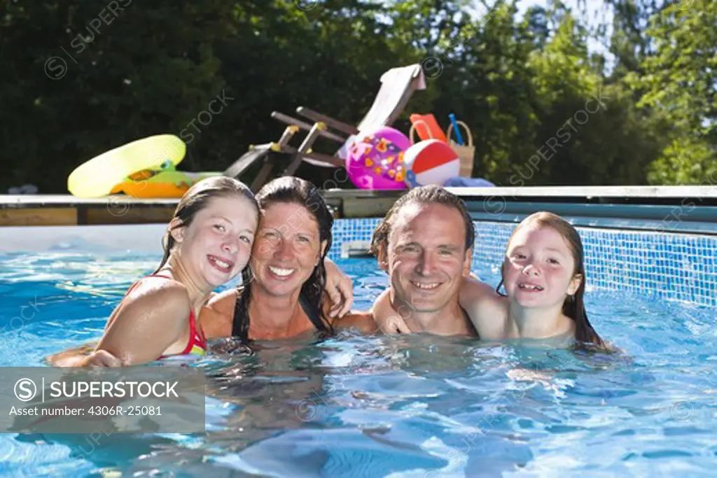 Portrait of family in swimming pool