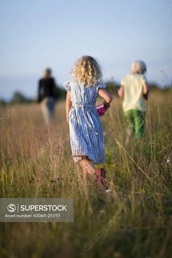 Three girls on meadow