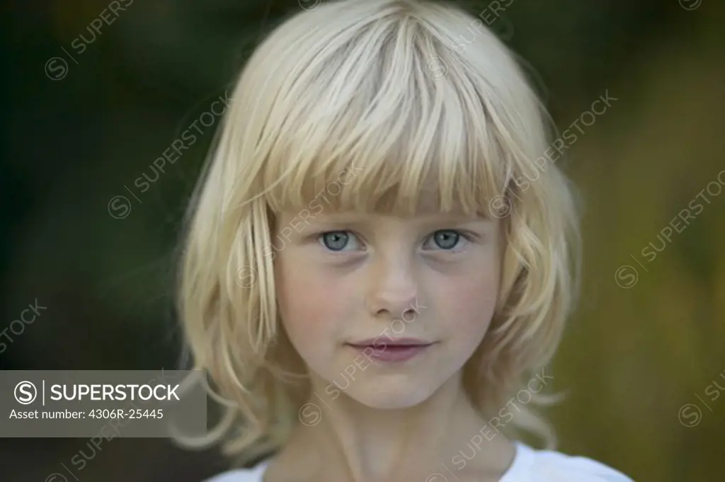 Portrait of blonde girl outdoors