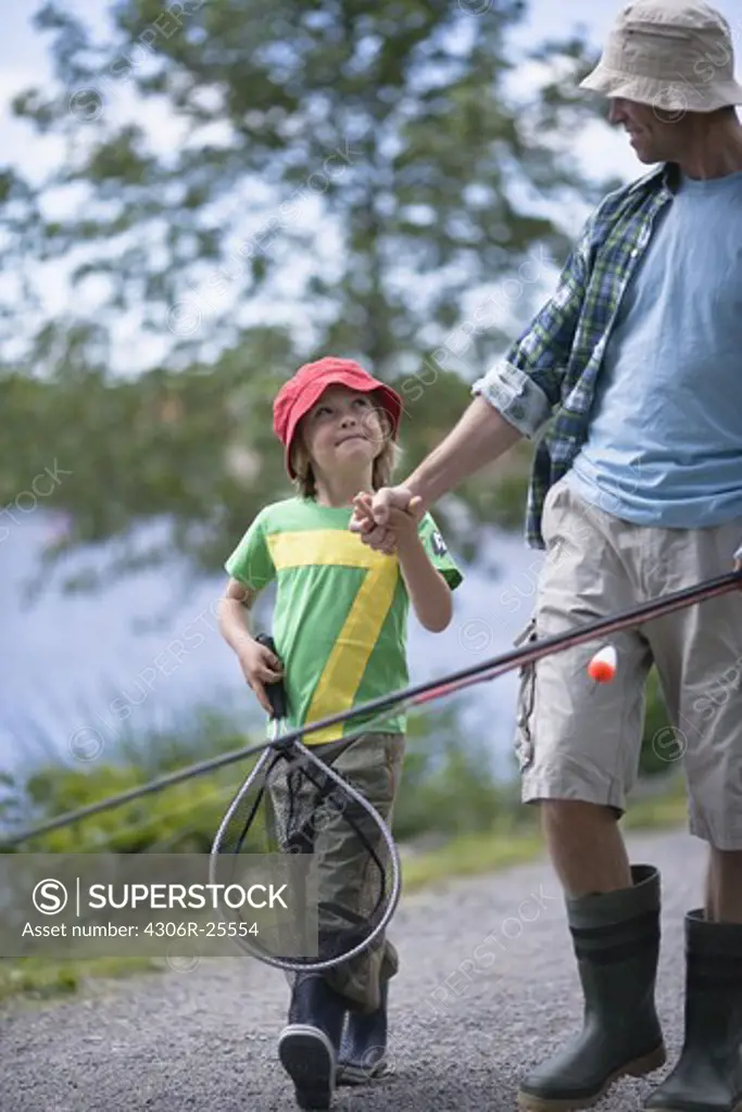 Boy with father going fishing