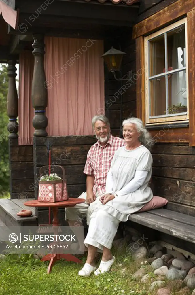 Senior couple sitting in backyard