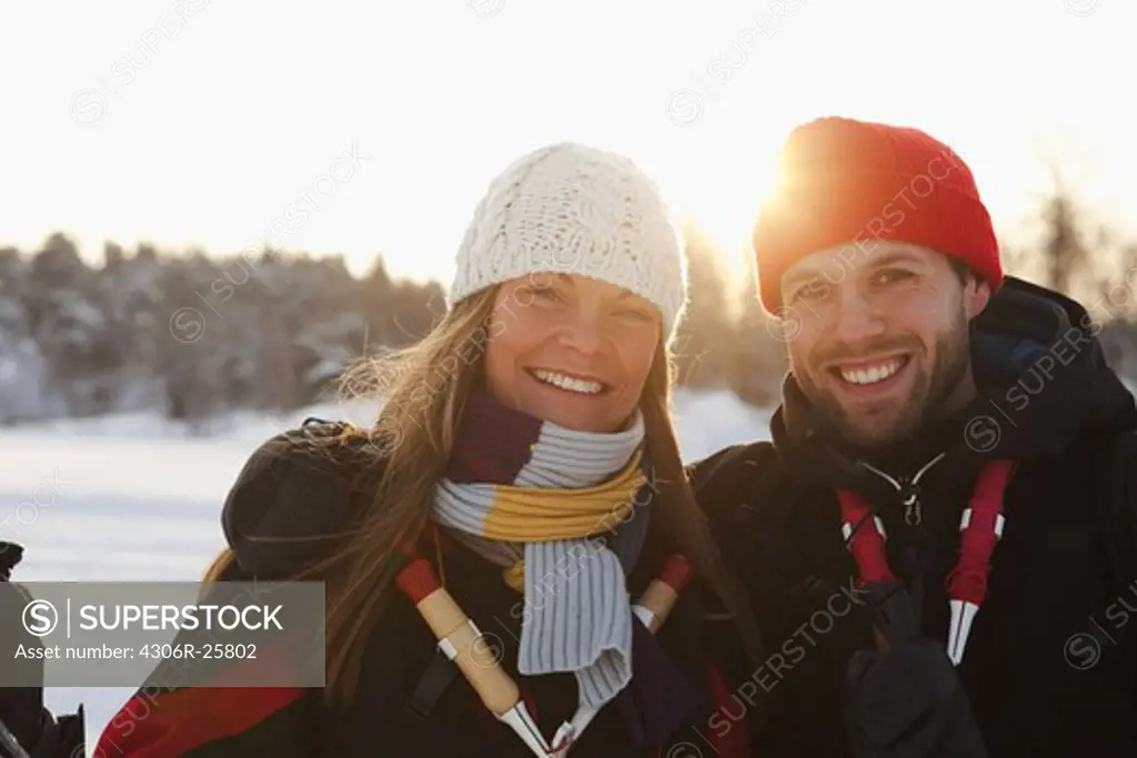 Happy mid adult couple in winter, portrait