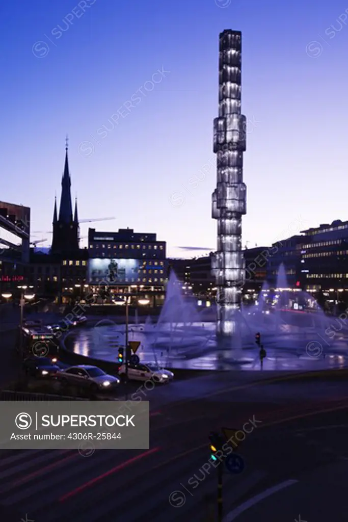 Sergels torg with fountains illuminated at dusk
