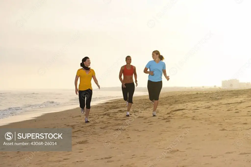 Women jogging on beach
