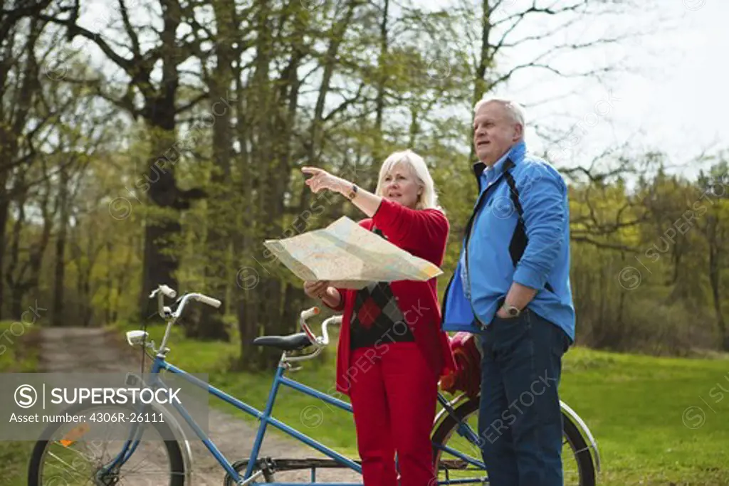 Senior couple with tandem bicycle