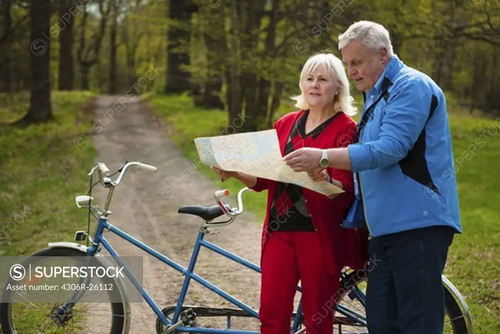 Senior couple with tandem bicycle