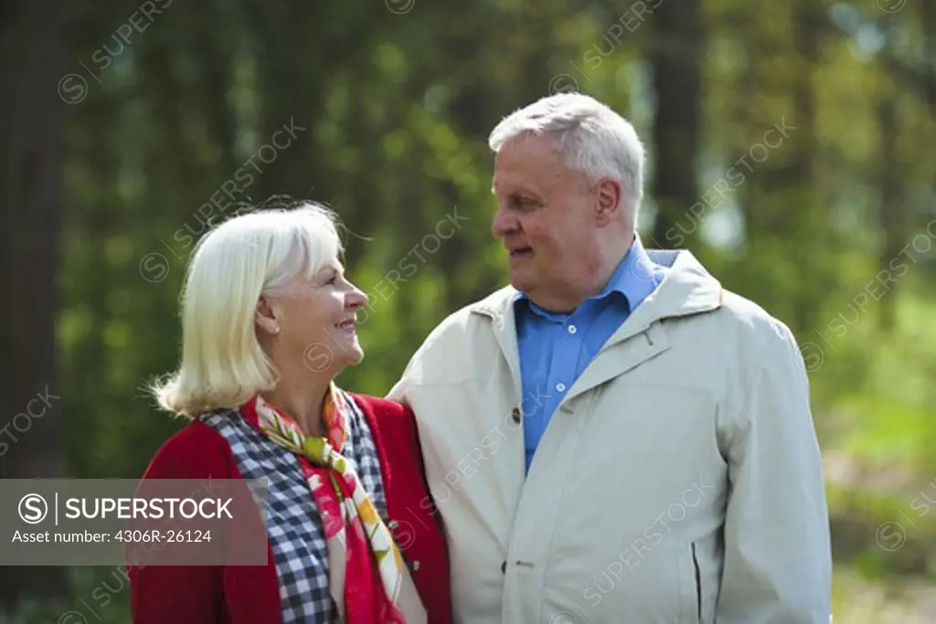 Senior couple embracing in park