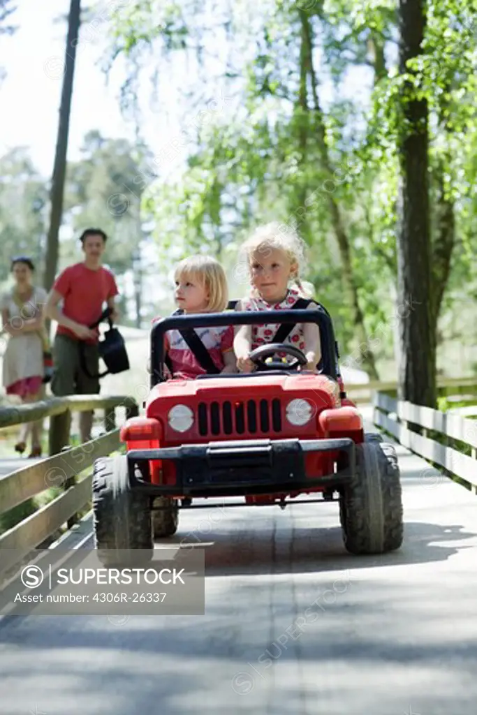 Two  girls in go-cart