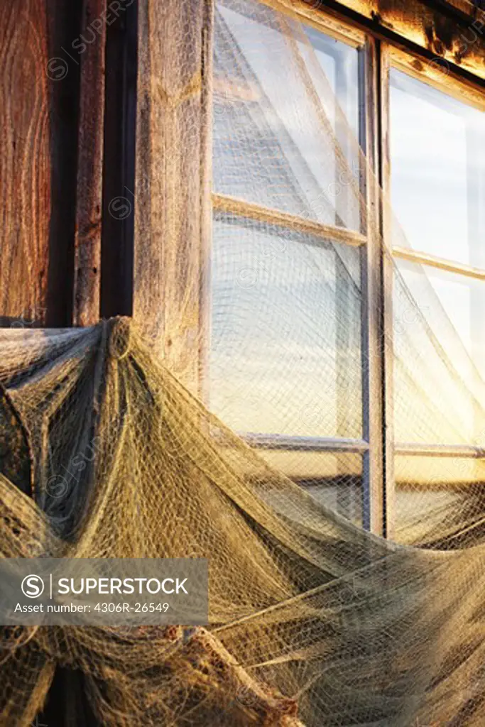 Fishing nets drying on boathouse