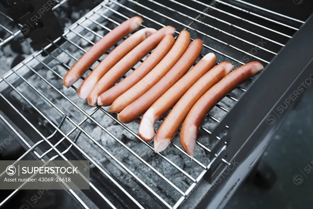 Hot dog sausages on grill