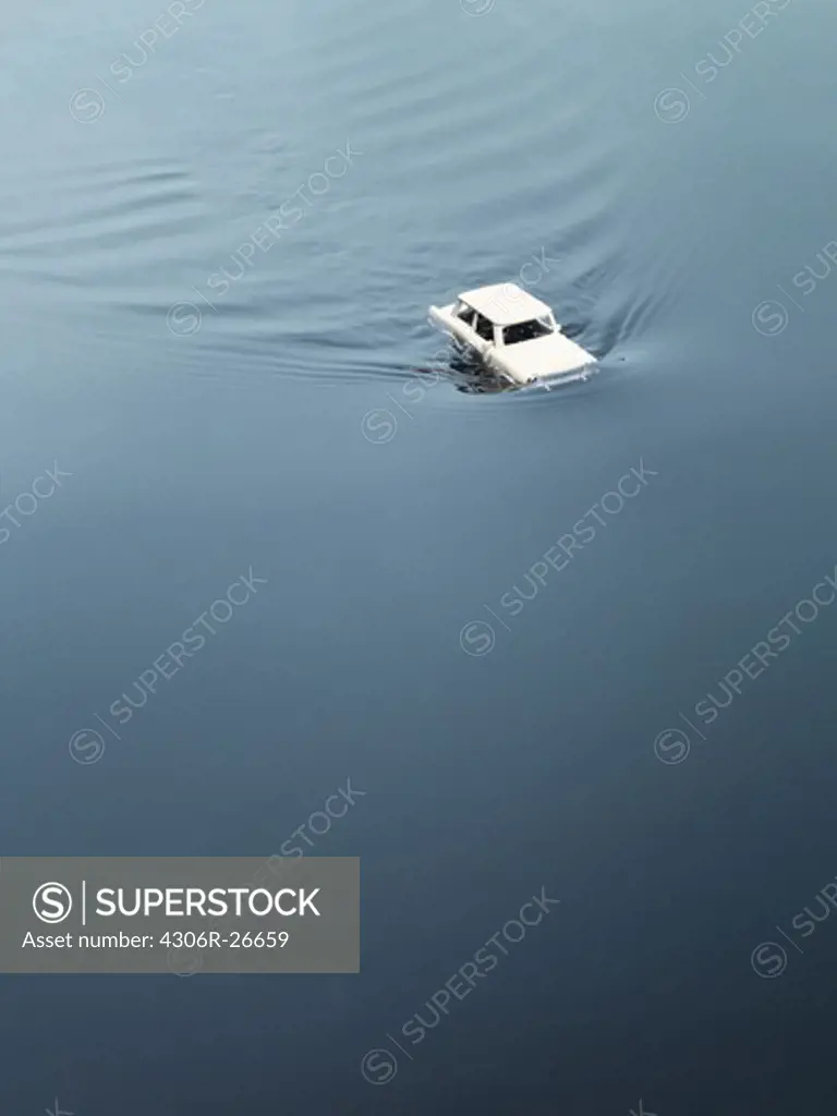 Toy car drowning in water