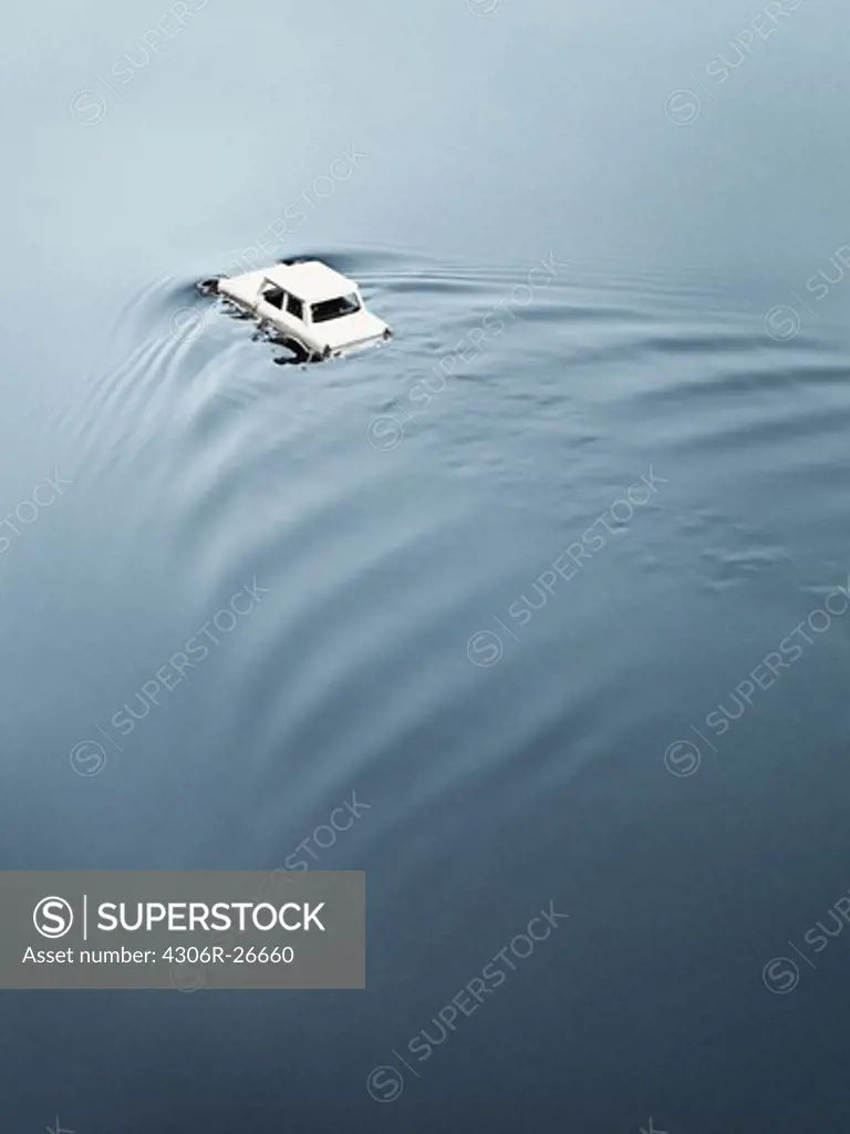 Toy car drowning in water