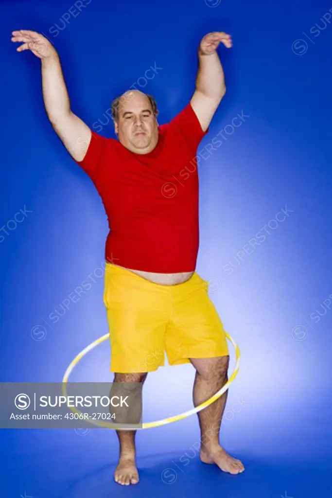 Obese man with hula hoop