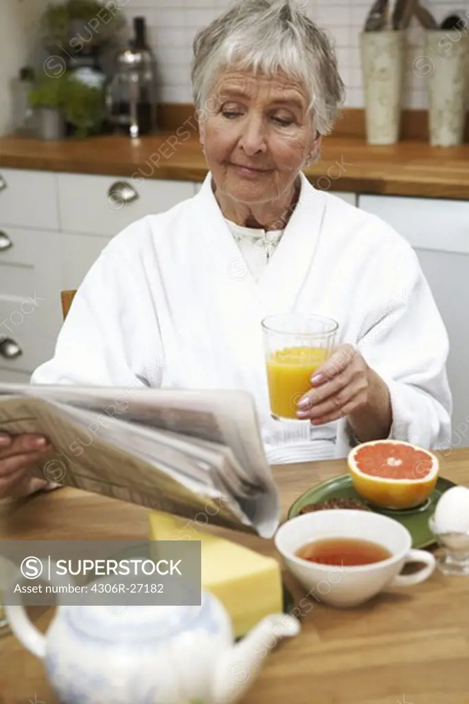 An elderly woman having breakfast, Sweden.