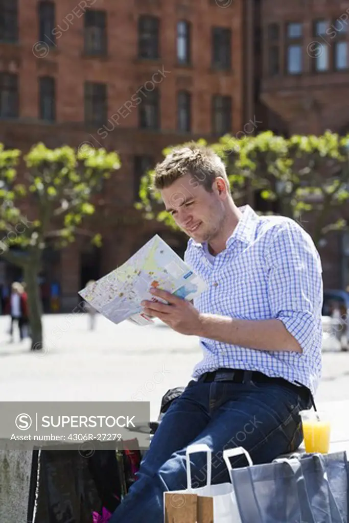 A man reading a map, Sweden.