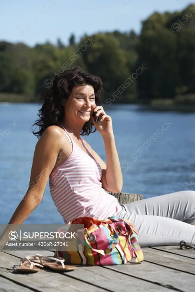 A  woman using a mobile phone, Sweden.