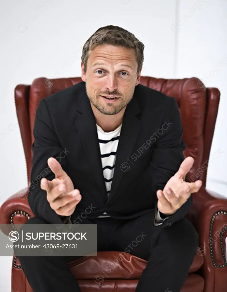 Portrait of businessman in armchair