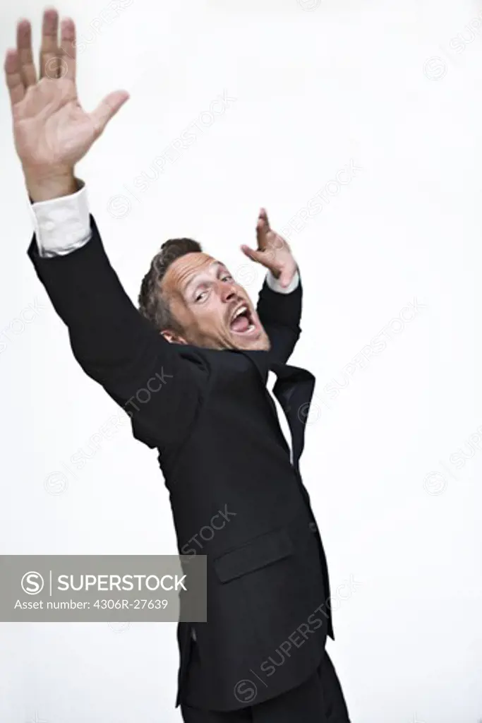 Studio portrait of businessman yelling