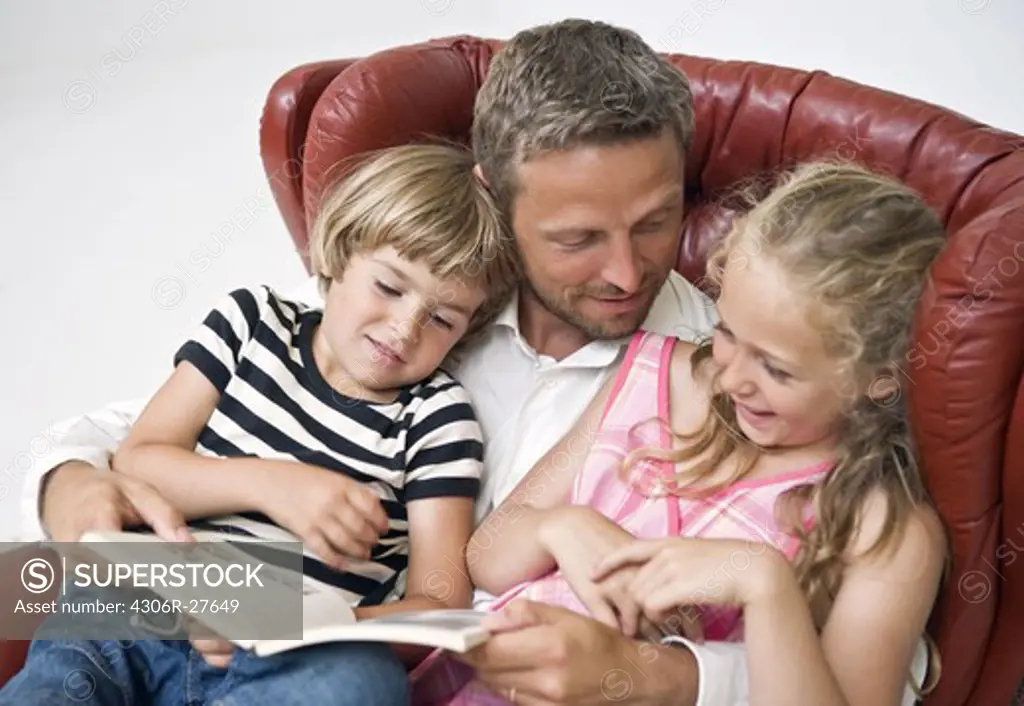 Father reading to kids