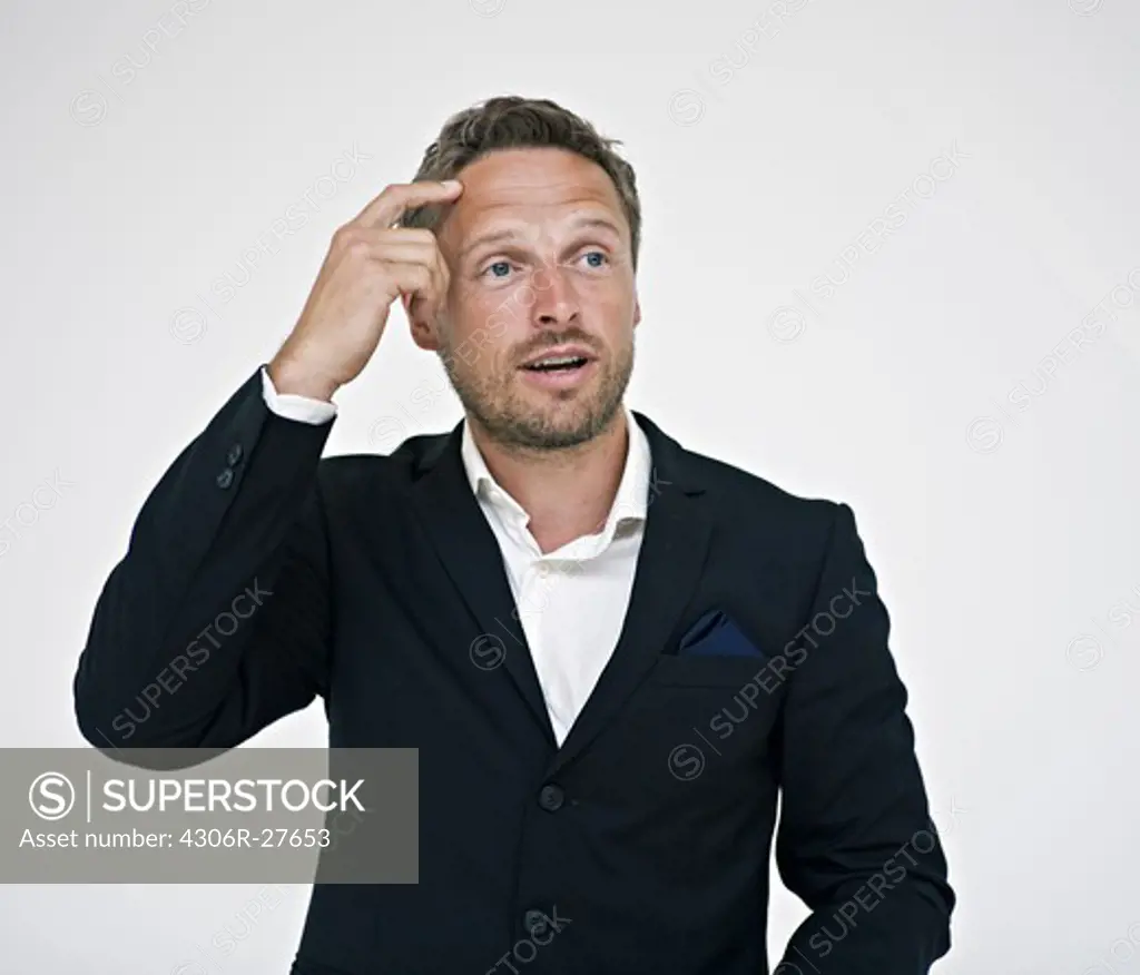 Studio portrait of businessman gesturing