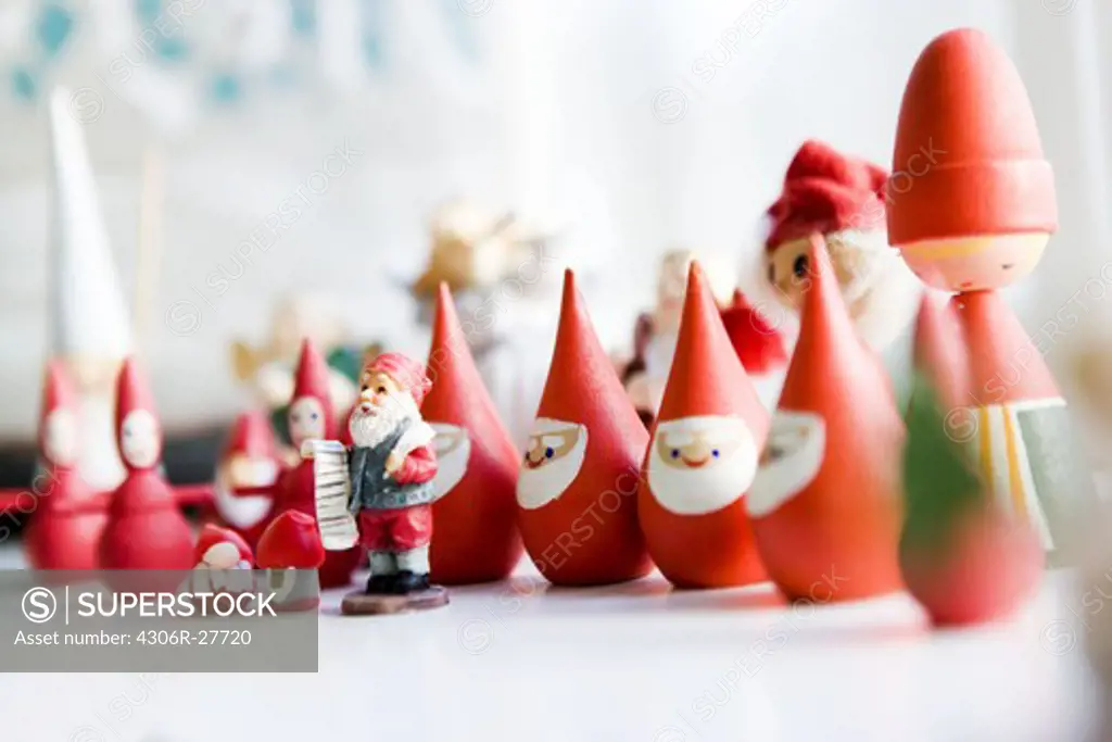 Row of Christmas craft products resembling Santa Claus