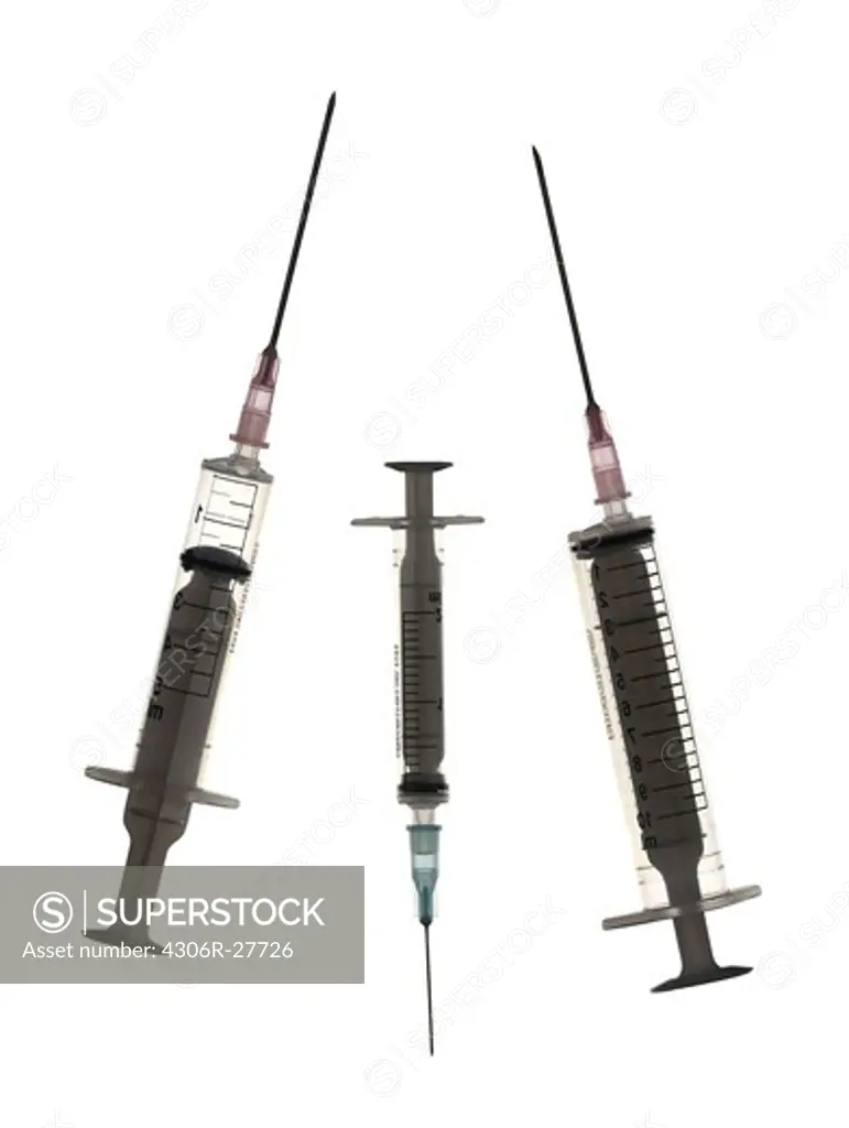 Studio shot of three syringes