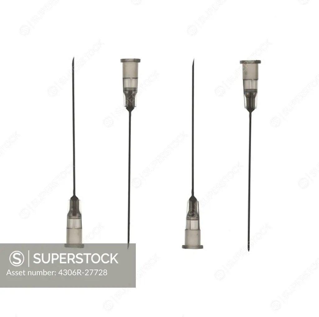 Studio shot of four syringe needles