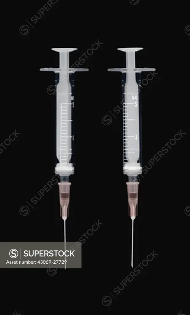 Studio shot of two syringe needles