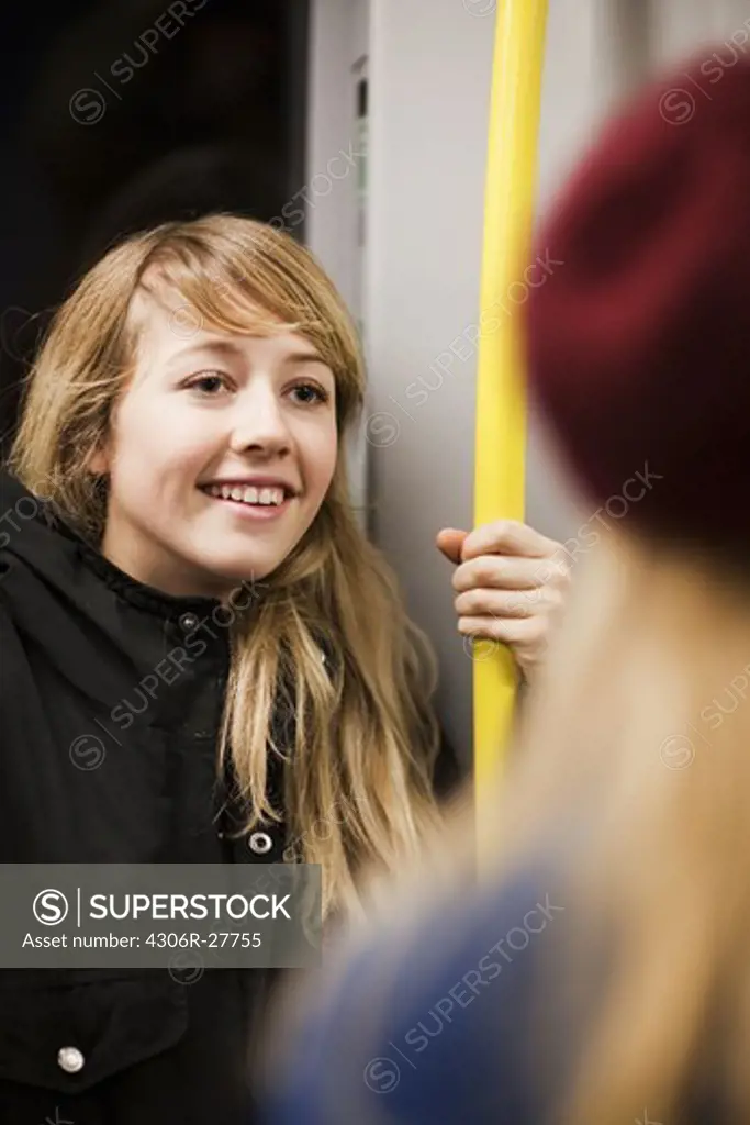 Teenage girl (14-15) in underground train