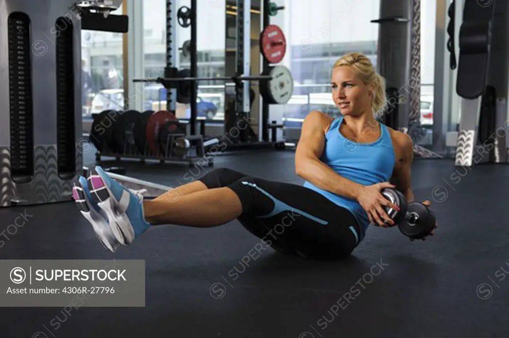 Woman exercising in gym