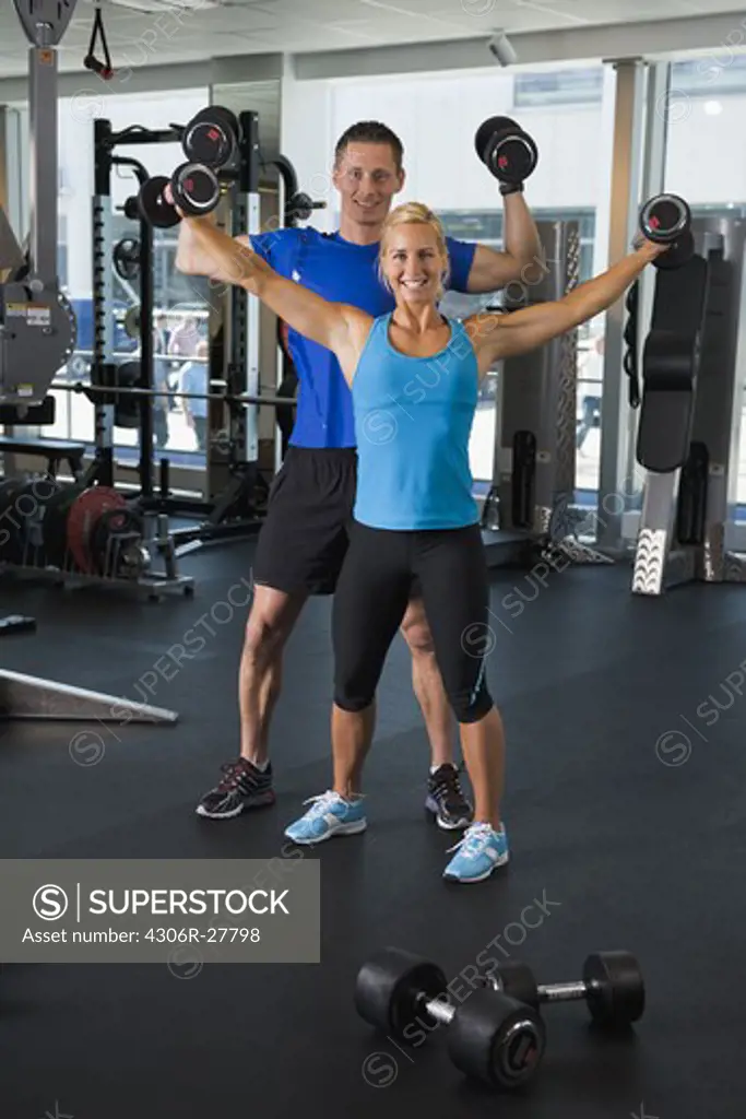 Couple exercising in gym