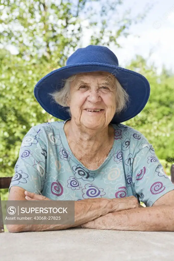 Portrait of senior woman wearing sun hat
