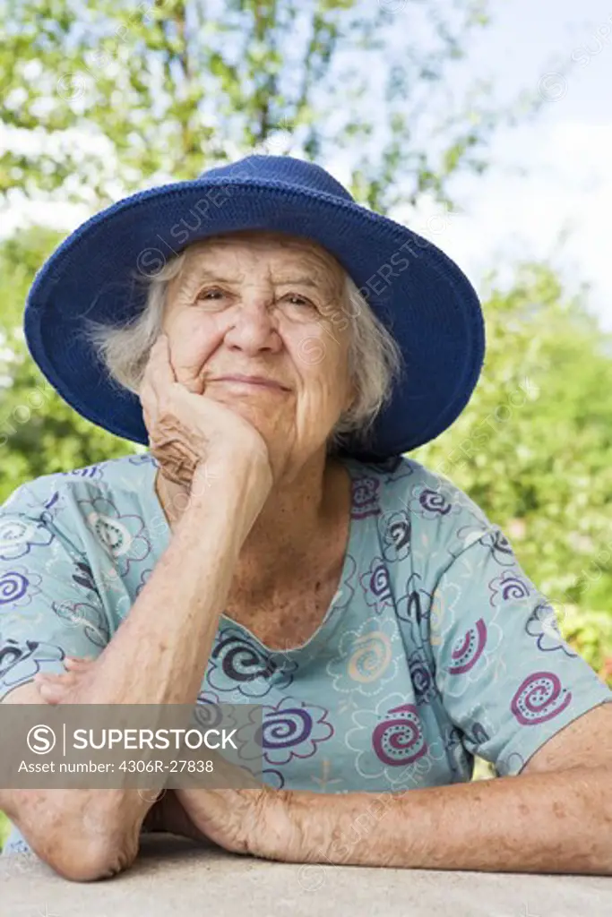 Portrait of senior woman wearing blue hat