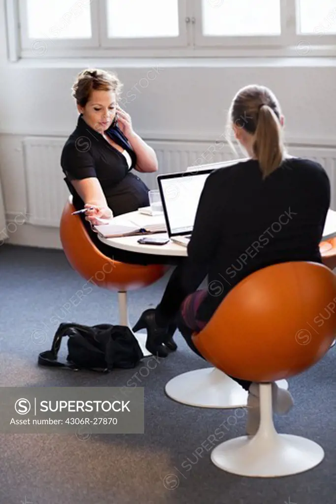 Pregnant women at a office