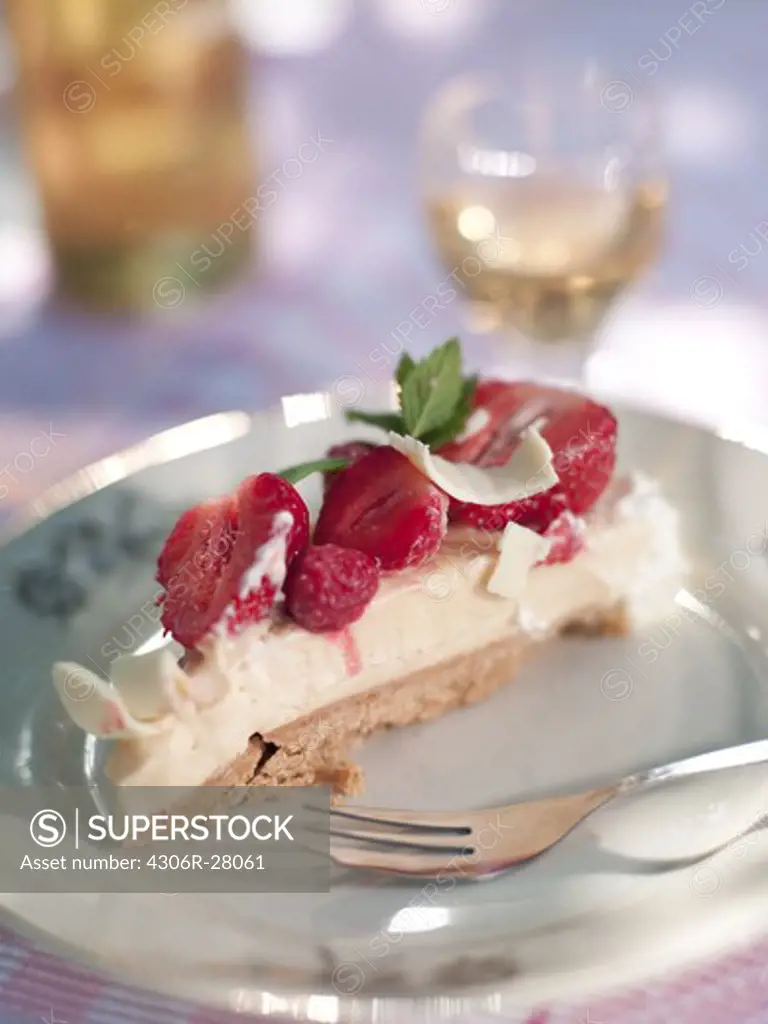 Strawberries cake slice on plate, clsoe-up